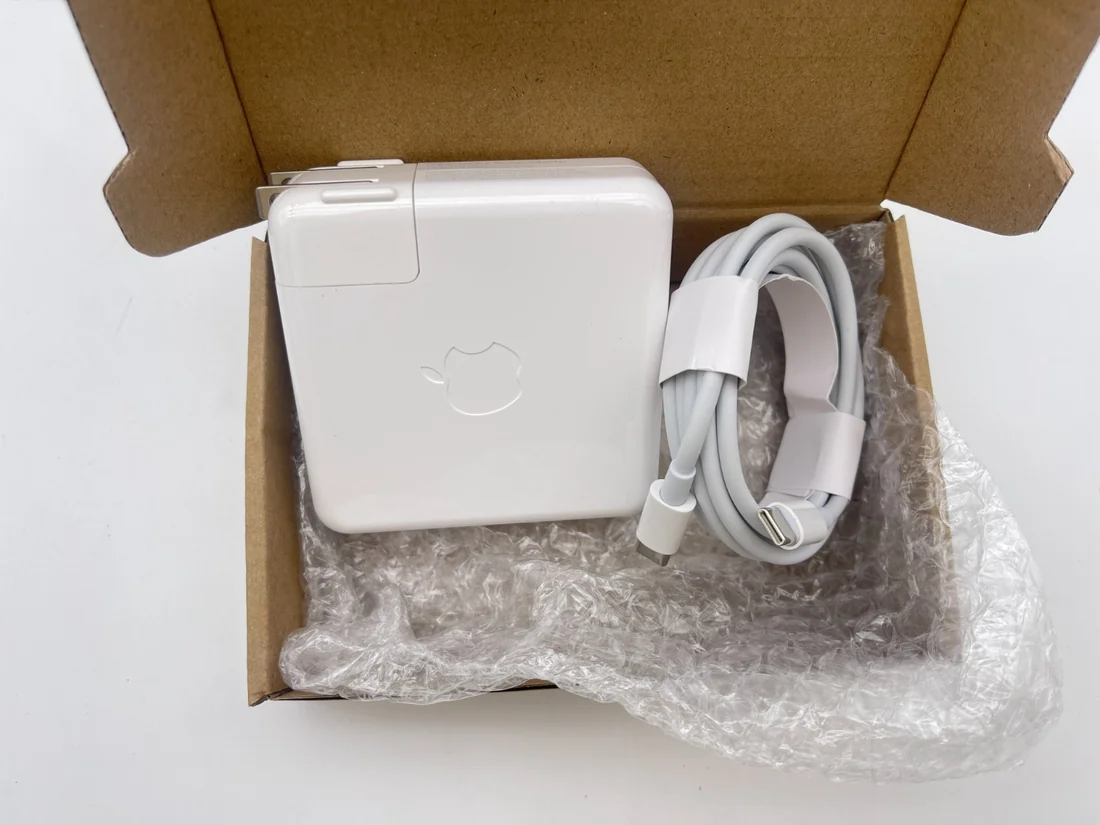 Apple 87W USB-C Power Adapter for MacBook Pro 15 A1990 / A1707 — Apple laptop side and angled view, buy in Lahore Pakistan